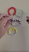 Load and play video in Gallery viewer, Video of the swiftie friendship bracelets.