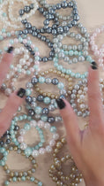 Load and play video in Gallery viewer, Video of the faux pearl fashion bracelets.