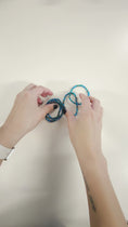 Load and play video in Gallery viewer, Video of the mermaid tail friendship bracelets.