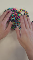 Load and play video in Gallery viewer, Video of the colorful stretch bracelets.
