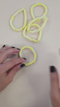 Load and play video in Gallery viewer, Video of the yellow spring flower stretch bracelet.