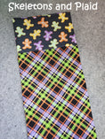 Load image into Gallery viewer, Skeletons and plaid halloween pillowcase.