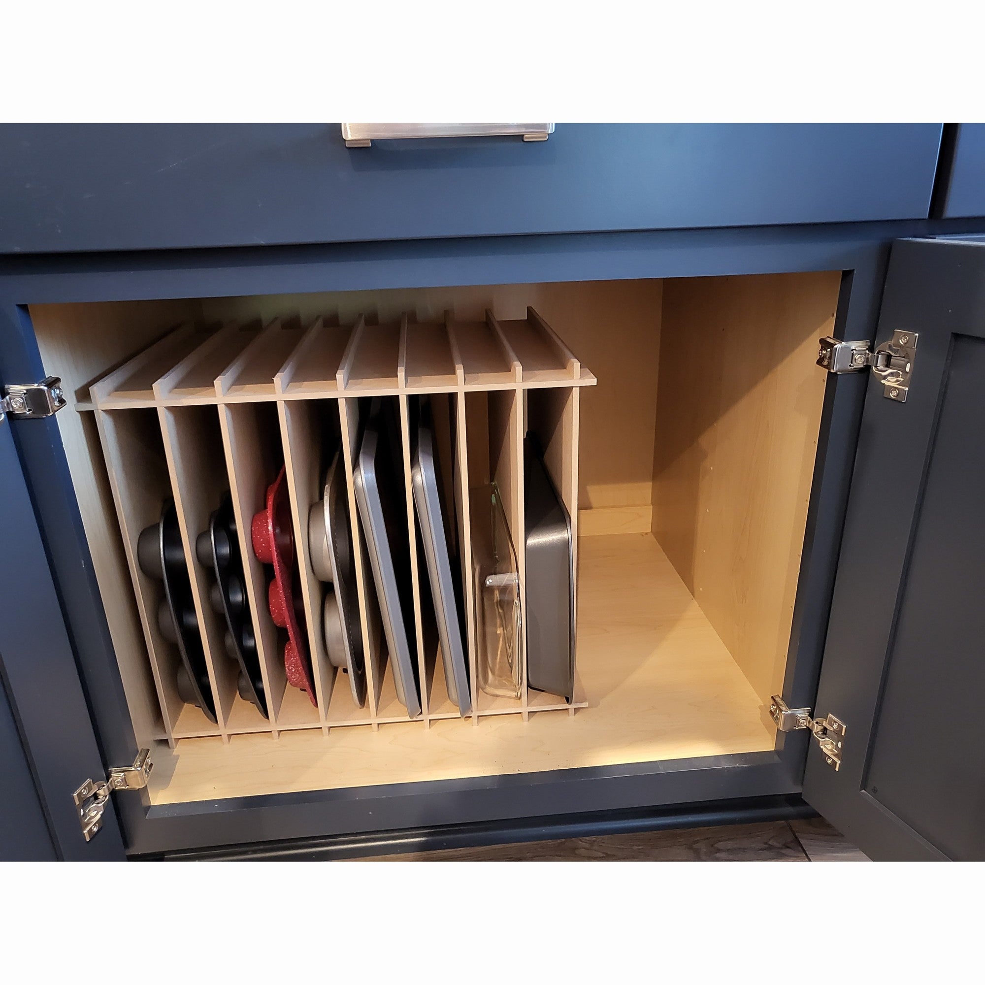 Deluxe muffin pan vertical in kitchen cabinet.