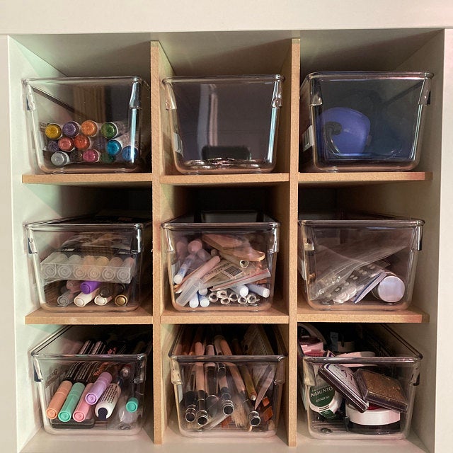 9 Cubby Cube Insert filled with clear containers full of crafting supplies.