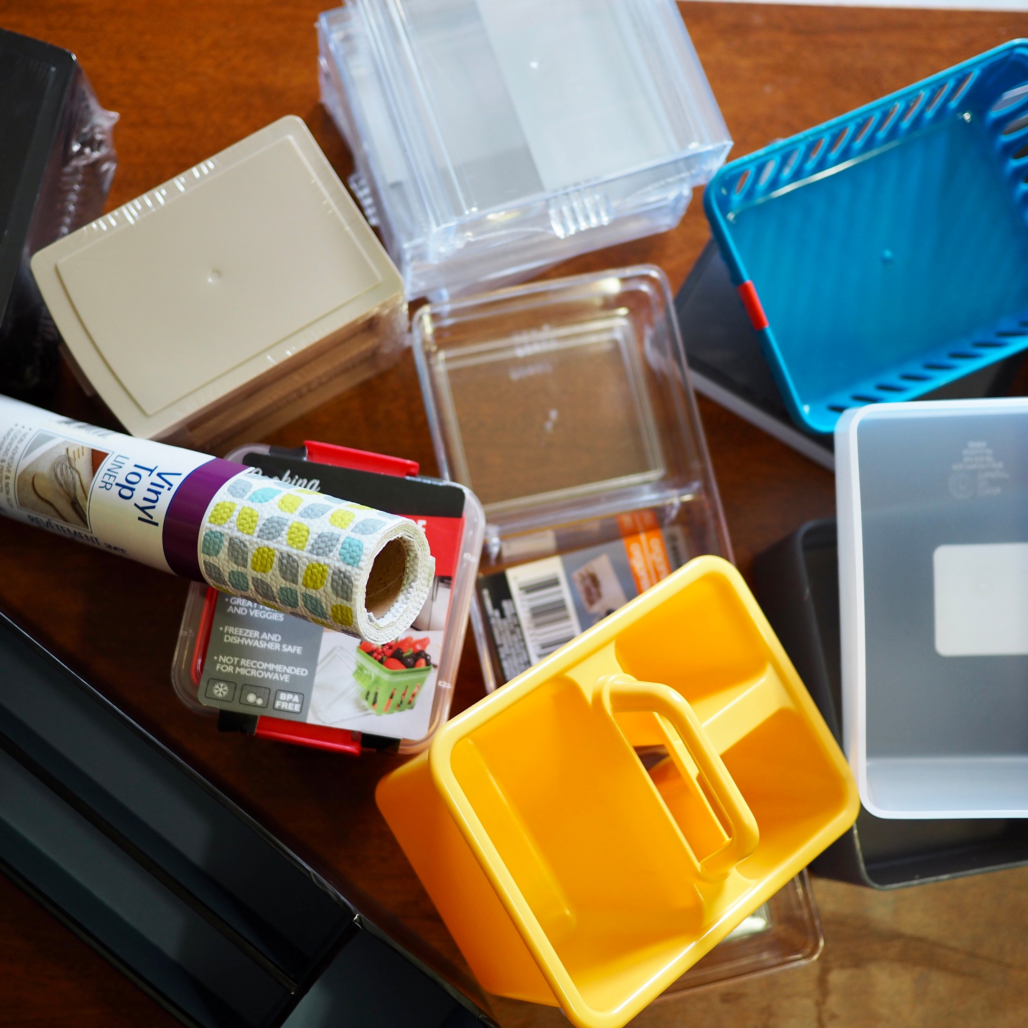 bunch of plastic bins, organizers and shelf liner