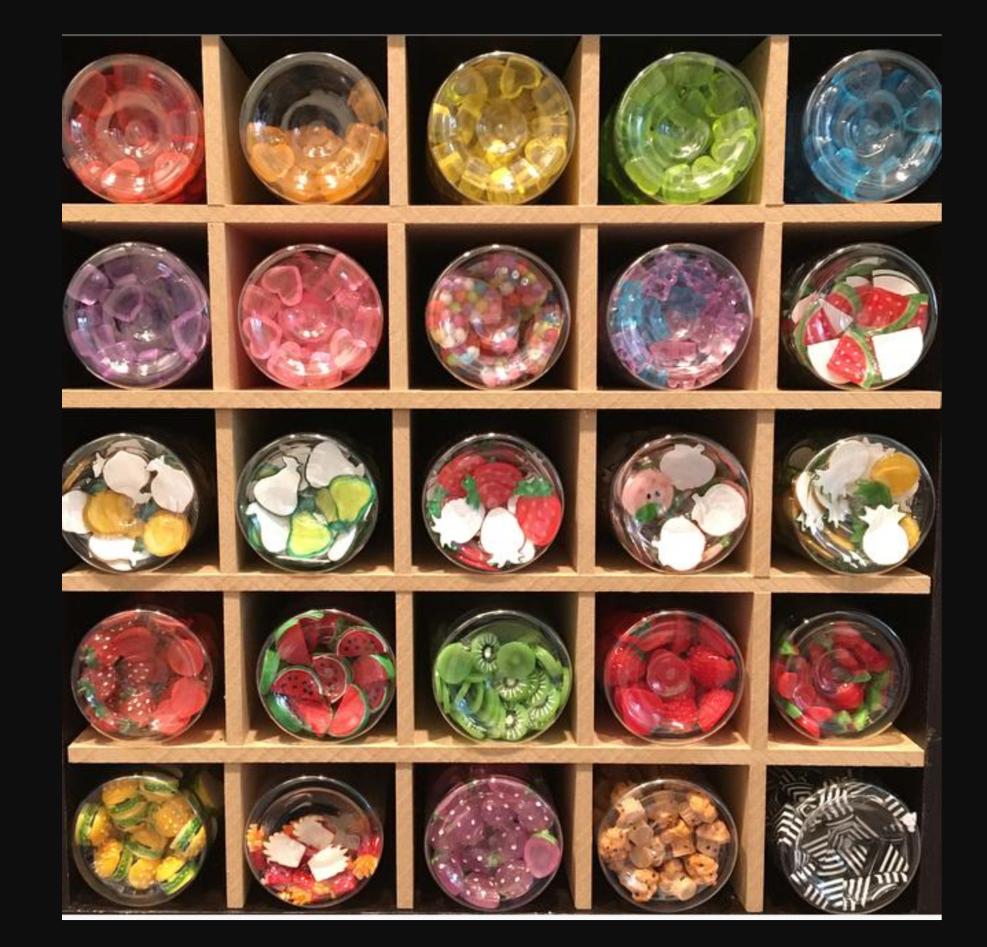 25 cubby cube insert from thesteadyhandshop.com filled with clear containers full of small craft supplies