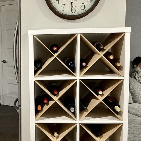 Cube shelf filled with X Divider Cube Inserts, storing wine.