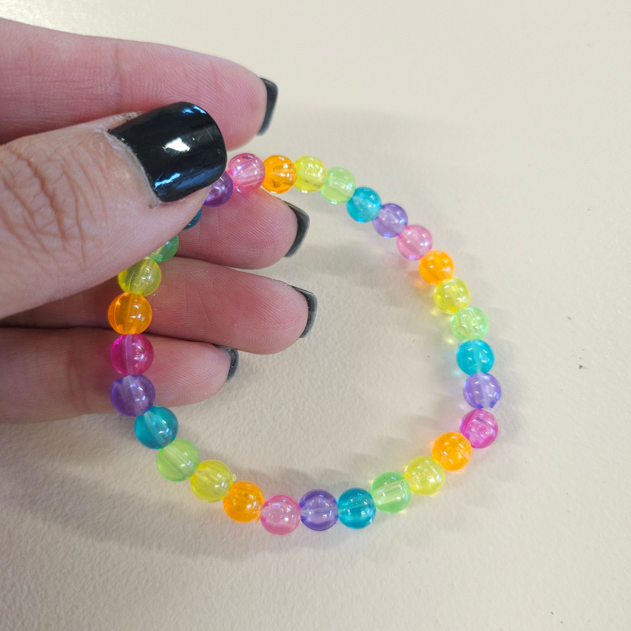 Transparent rainbow beaded bracelet.