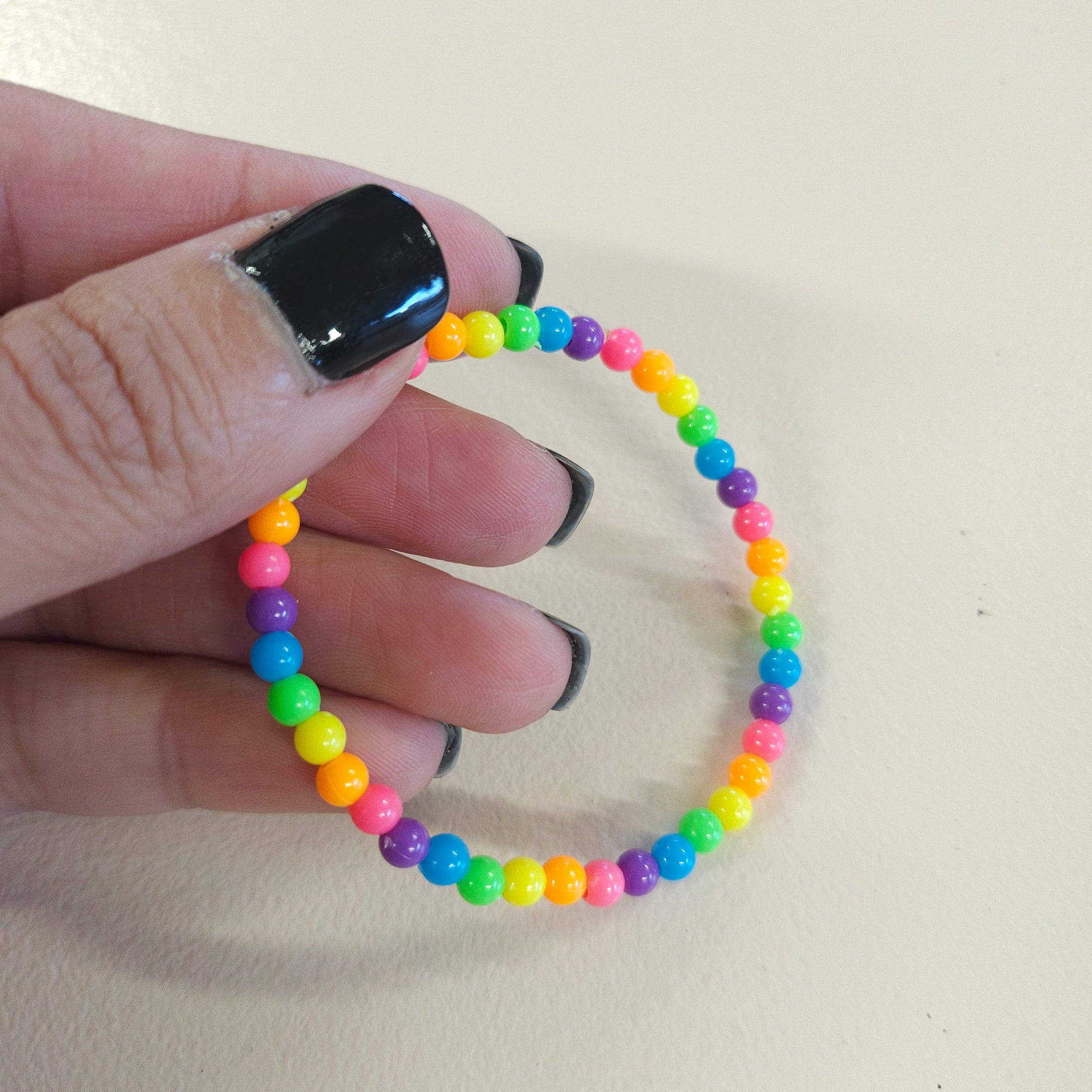 Tiny rainbow beaded bracelet.