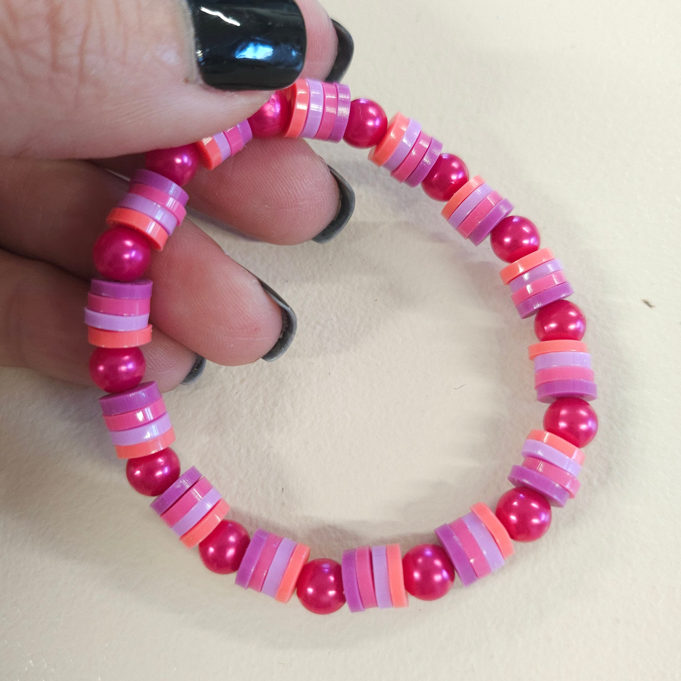 Pink colored bracelet.