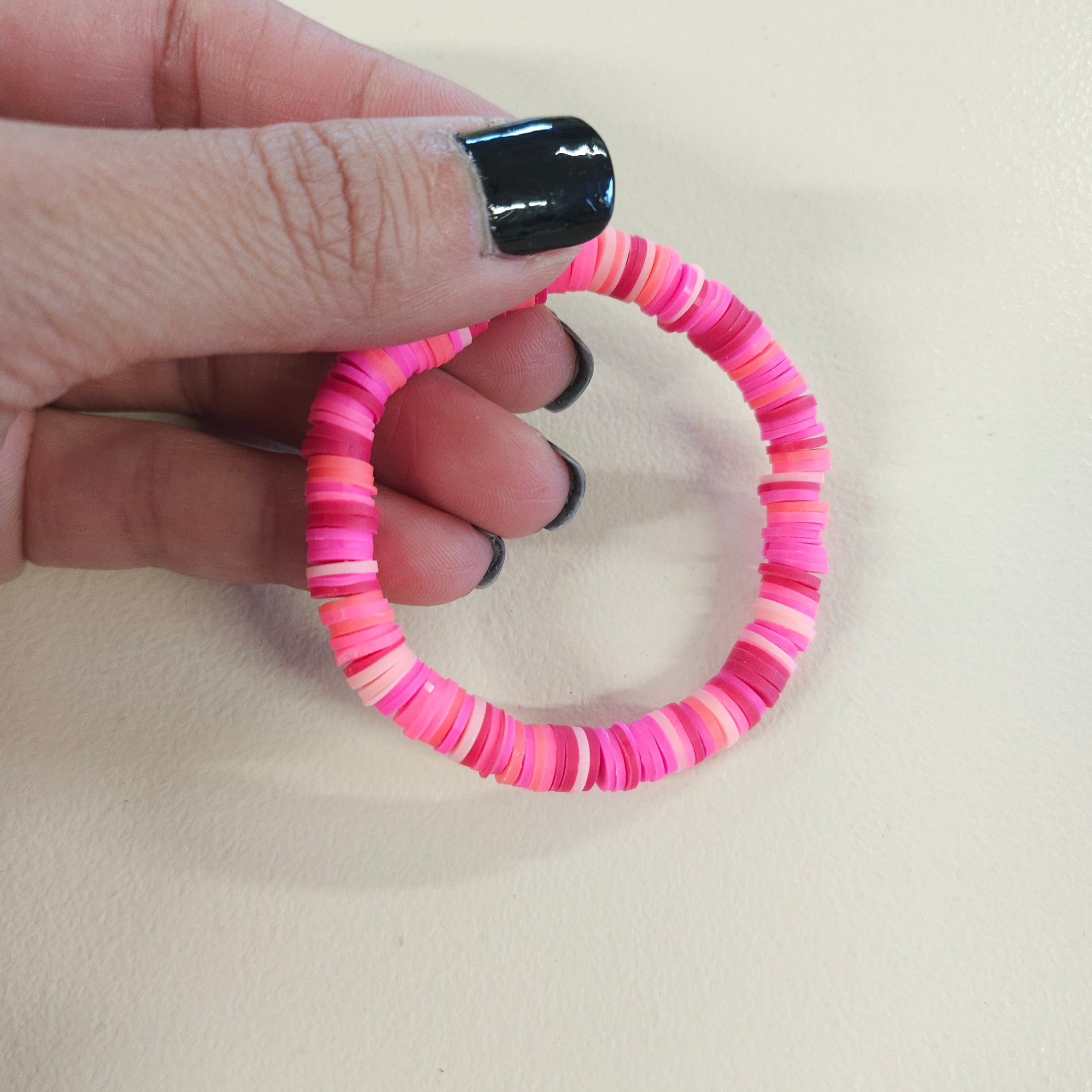 Pink clay bead bracelet.