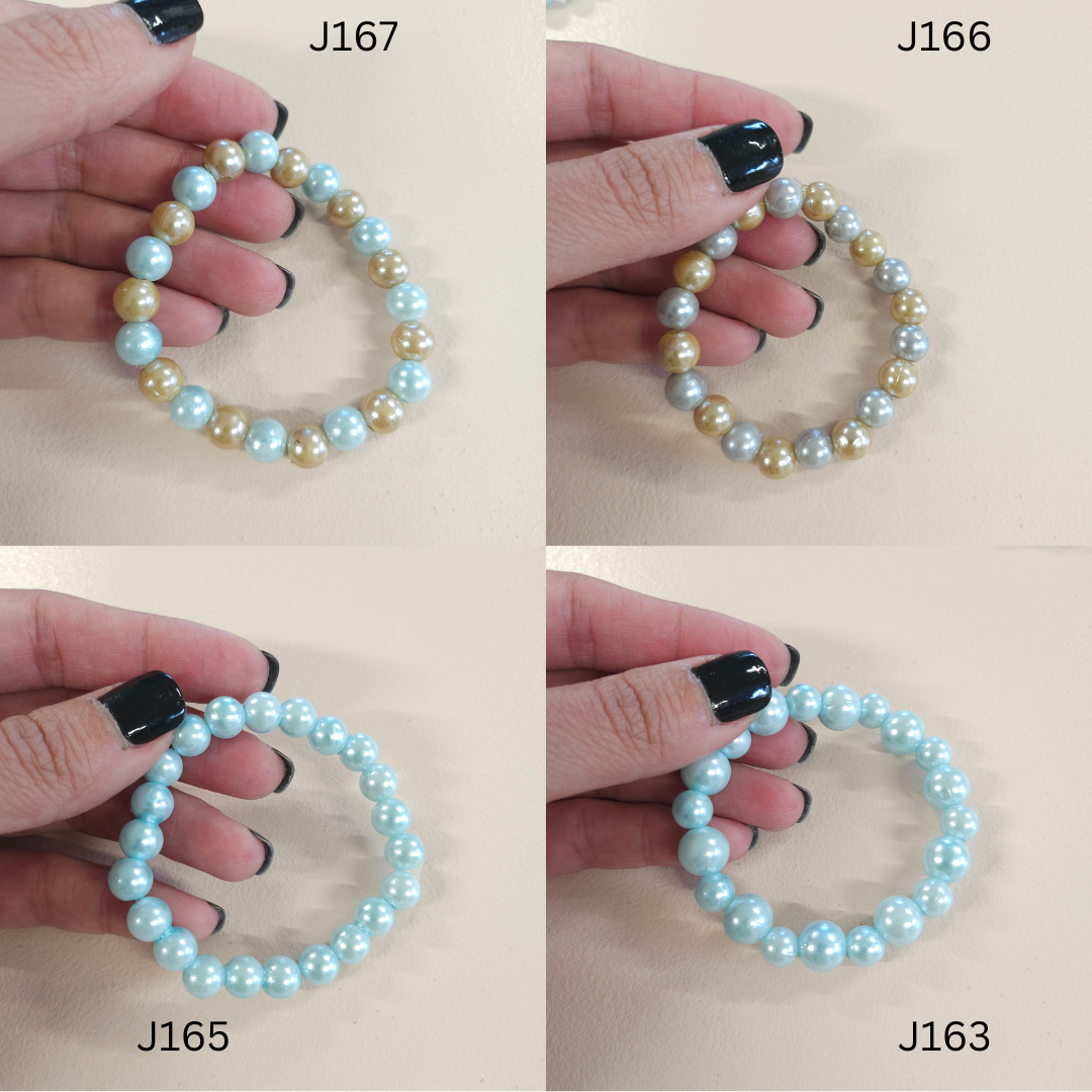 Faux pearl fashion bracelets in a variety of colors. 