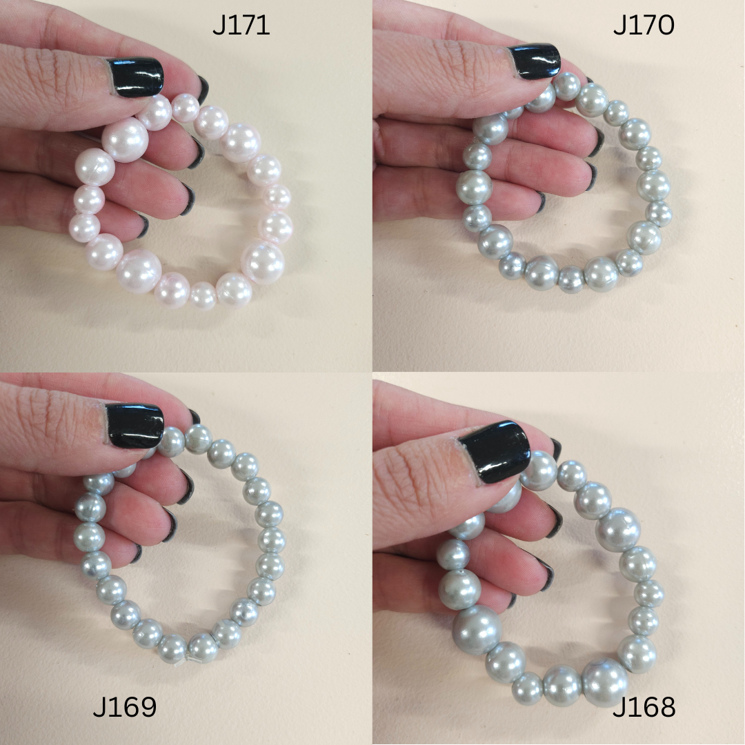 Faux pearl statement bracelets in a variety of colors. 