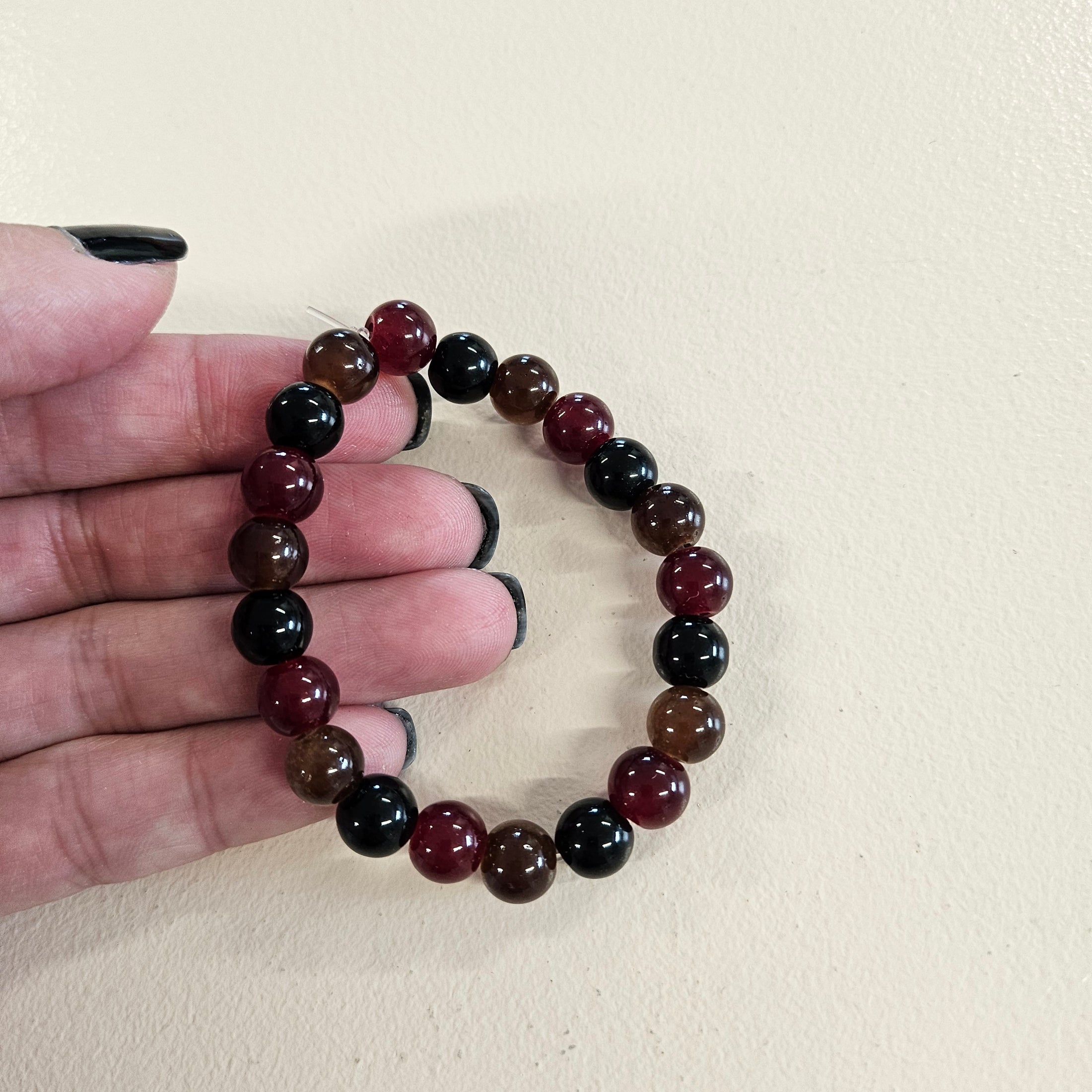 Dark colored glass ball bead stretch bracelet.