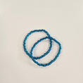 Load image into Gallery viewer, Ocean blue and green beaded stretchy bracelet. 
