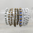 Load image into Gallery viewer, Metallic stretch bracelets on rack.
