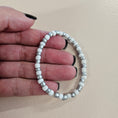 Load image into Gallery viewer, White and silver metallic stretch bracelet.
