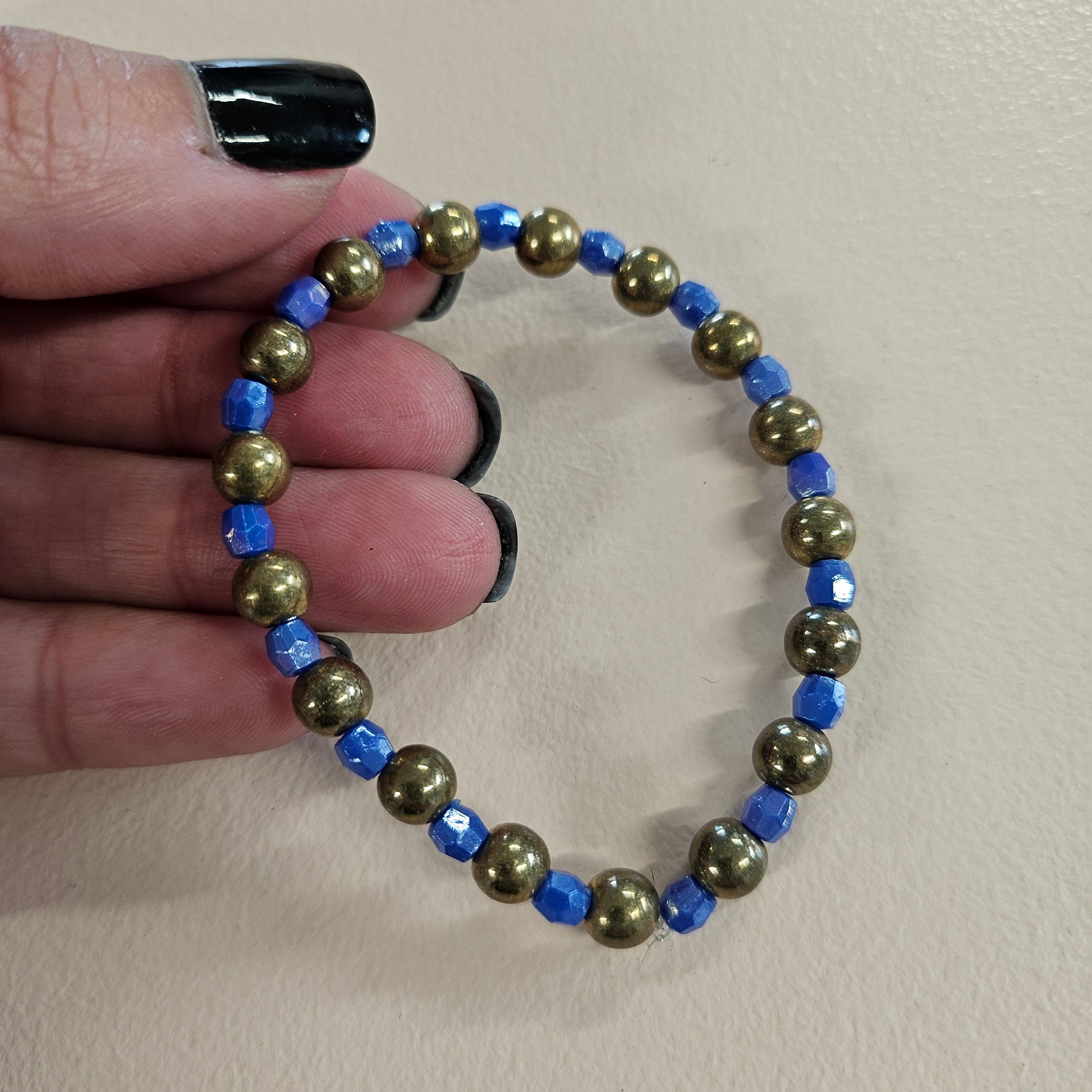 Blue and gold metallic stretch bracelet.