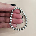 Load image into Gallery viewer, White and black stretch bracelet.
