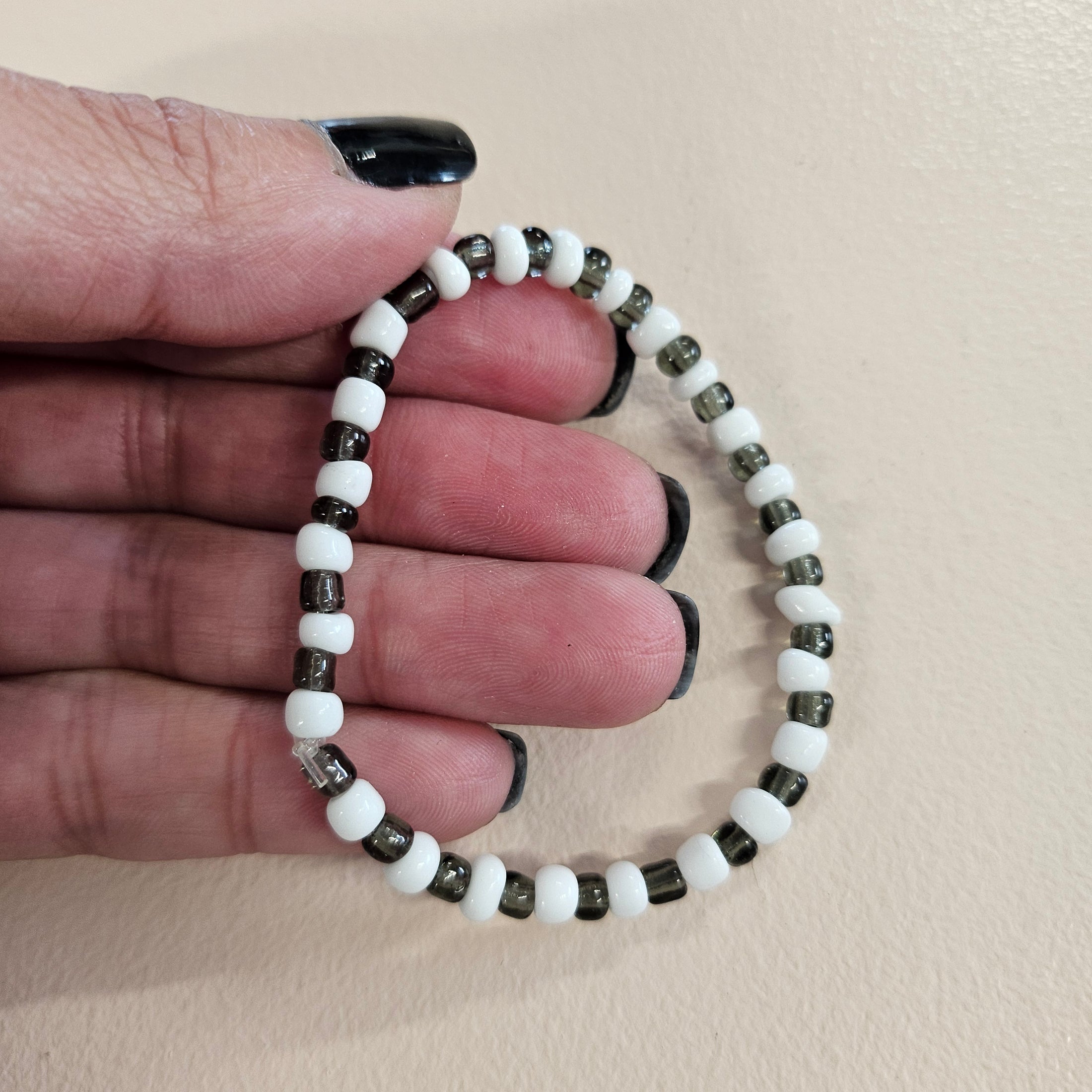 White and black stretch bracelet.