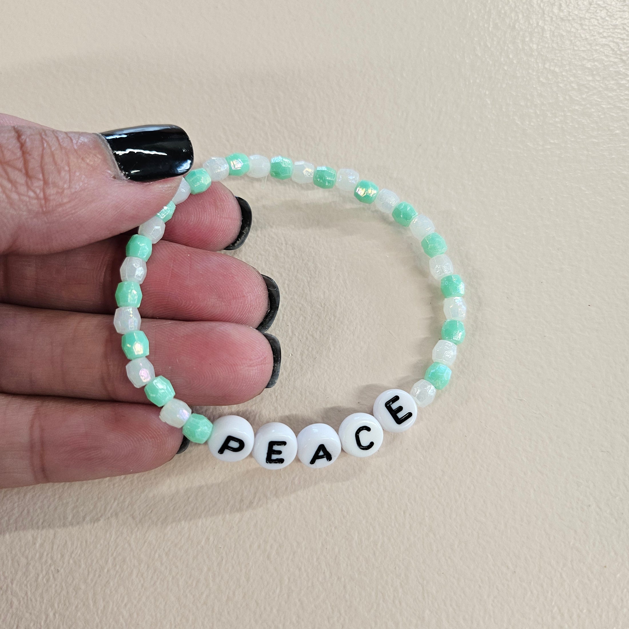 Peace swiftie friendship bracelet.