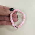 Load image into Gallery viewer, Pink smiley face friendship bracelet.
