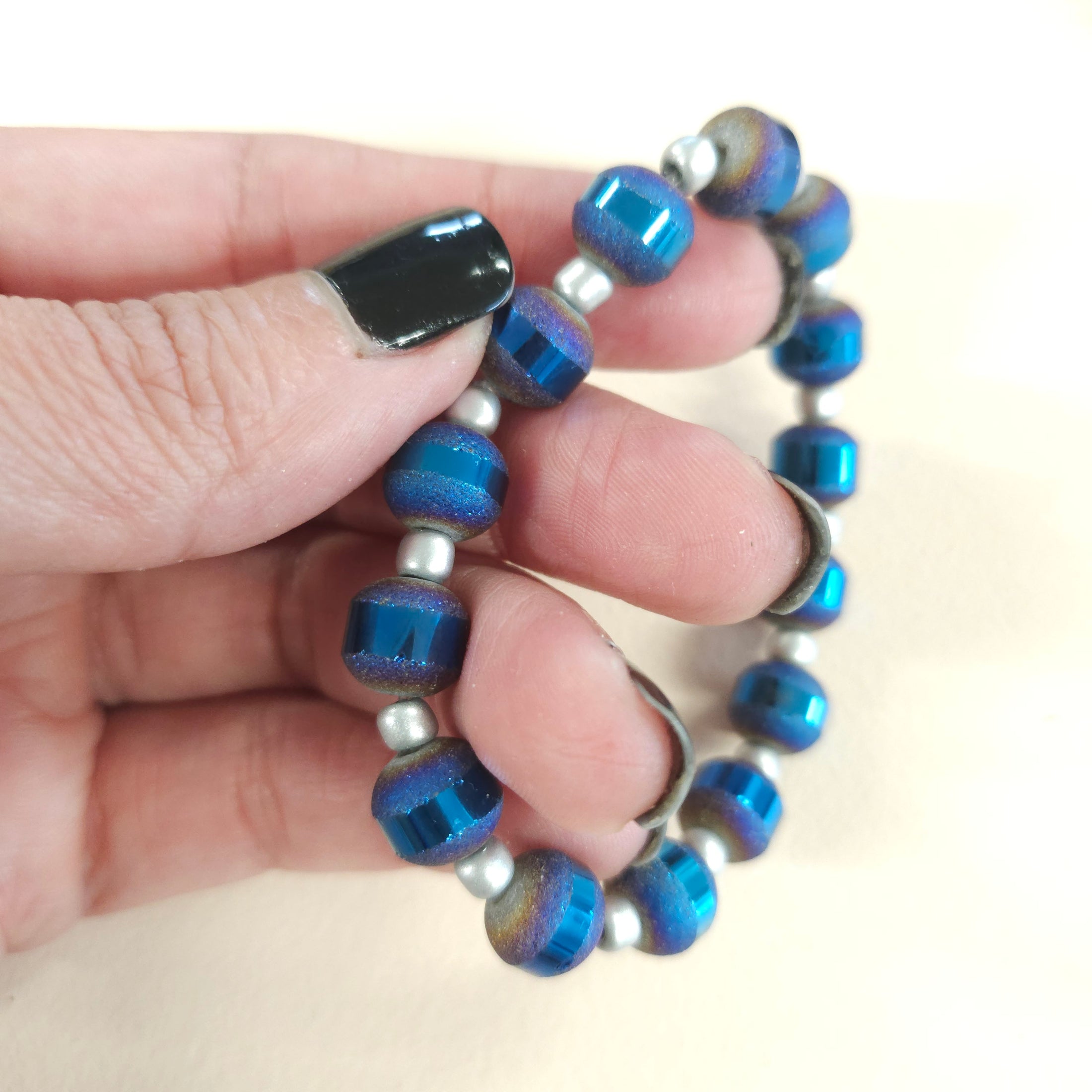 Metallic blue rainbow stretch bracelet.