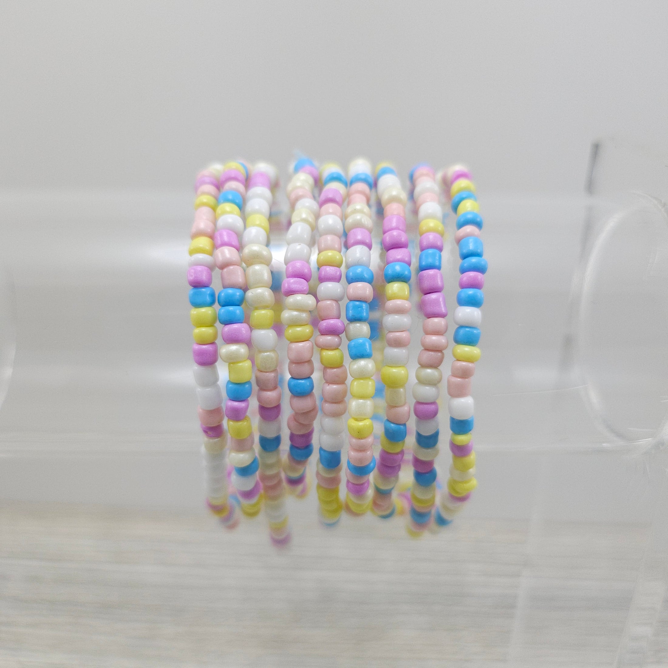 Easter themed friendship bracelets on stand. 