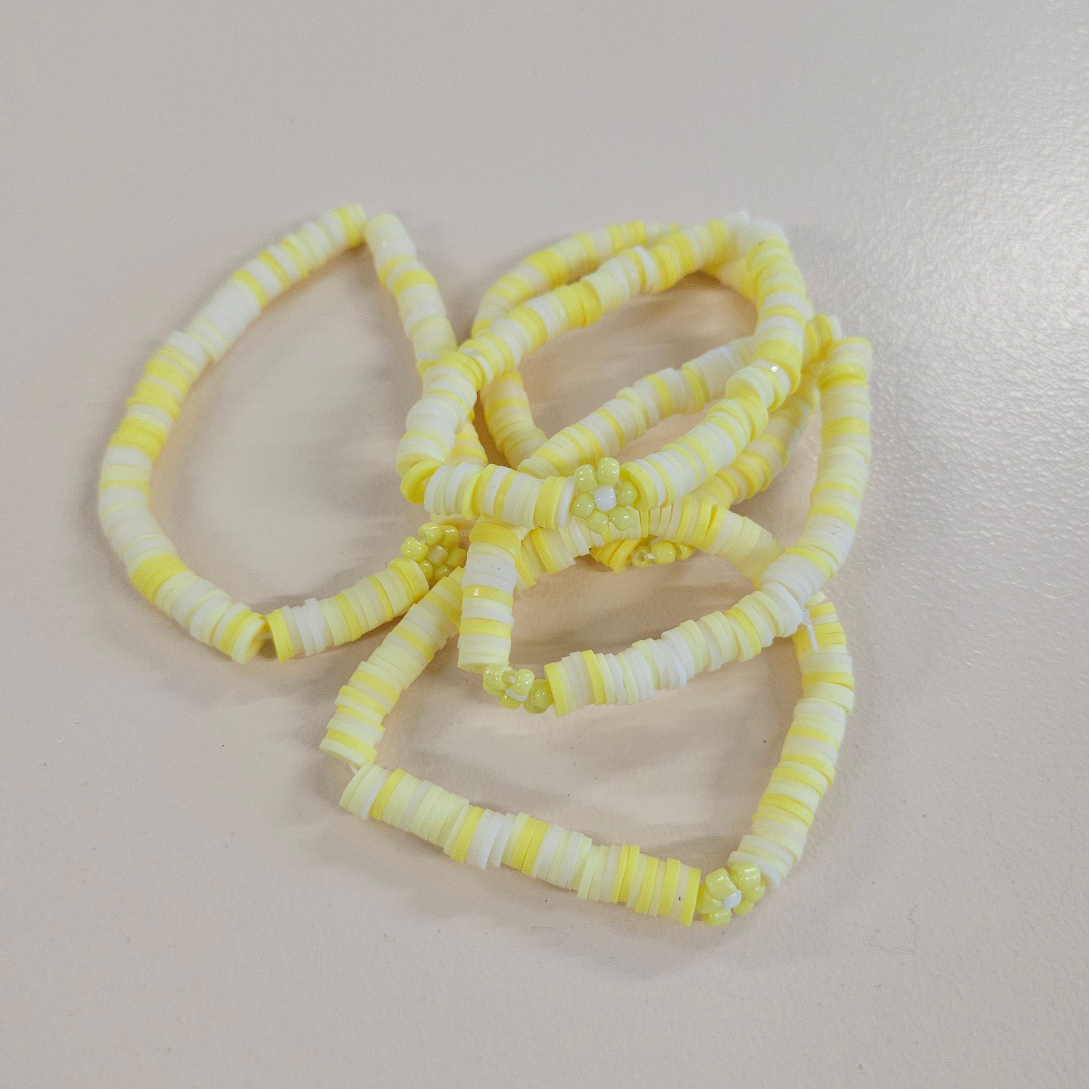 Yellow spring flower friendship bracelets.