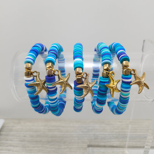 Ocean themed stretch friendship bracelets with gold starfish charm. 