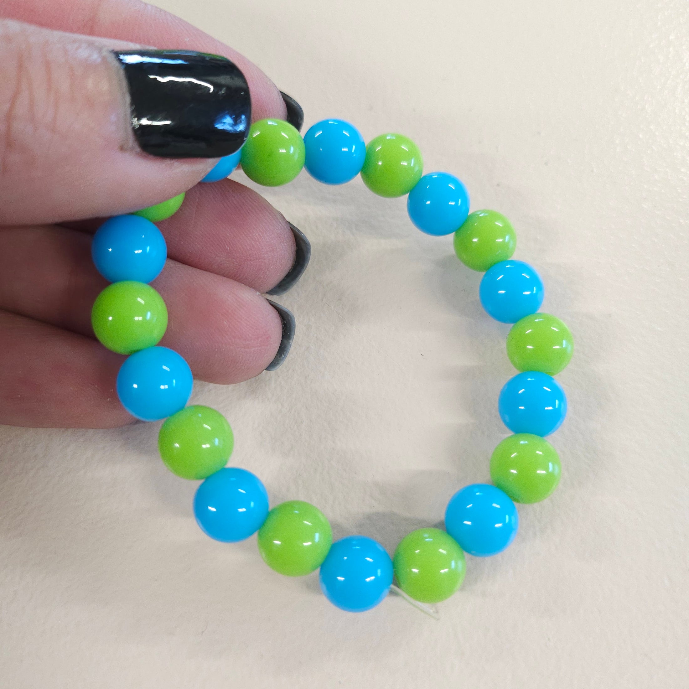 Blue and green ball bead stretch bracelet.