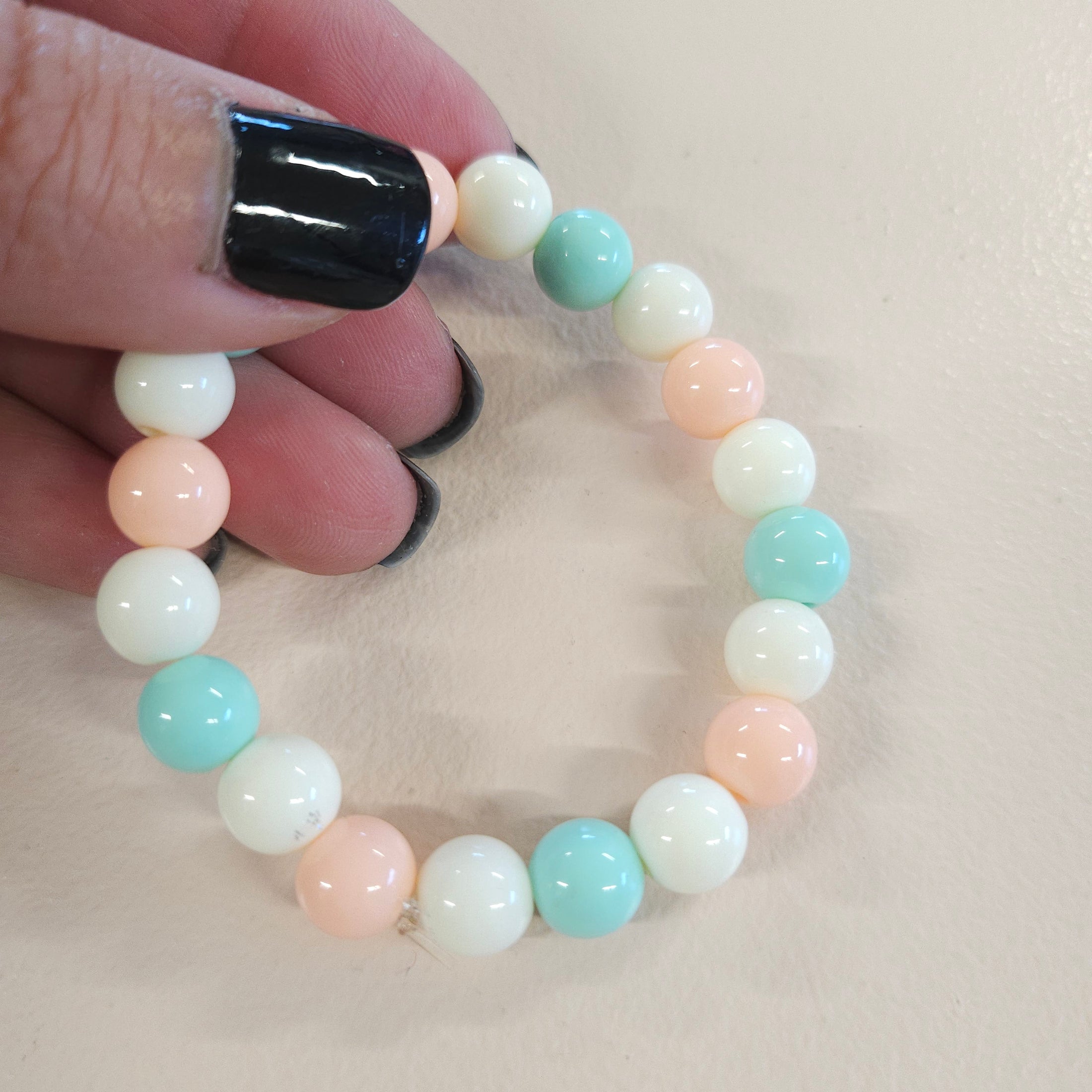 Pastel cream, green and pink stretch bracelet.