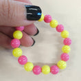 Load image into Gallery viewer, Pink lemonade friendship stretch bracelet.
