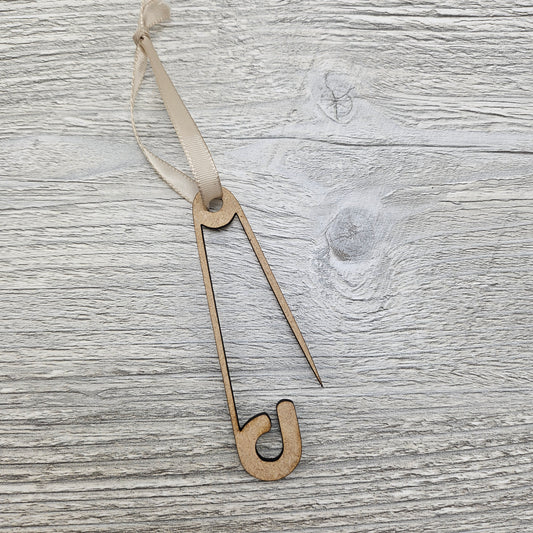 Laser cut safety pin ornament blank.