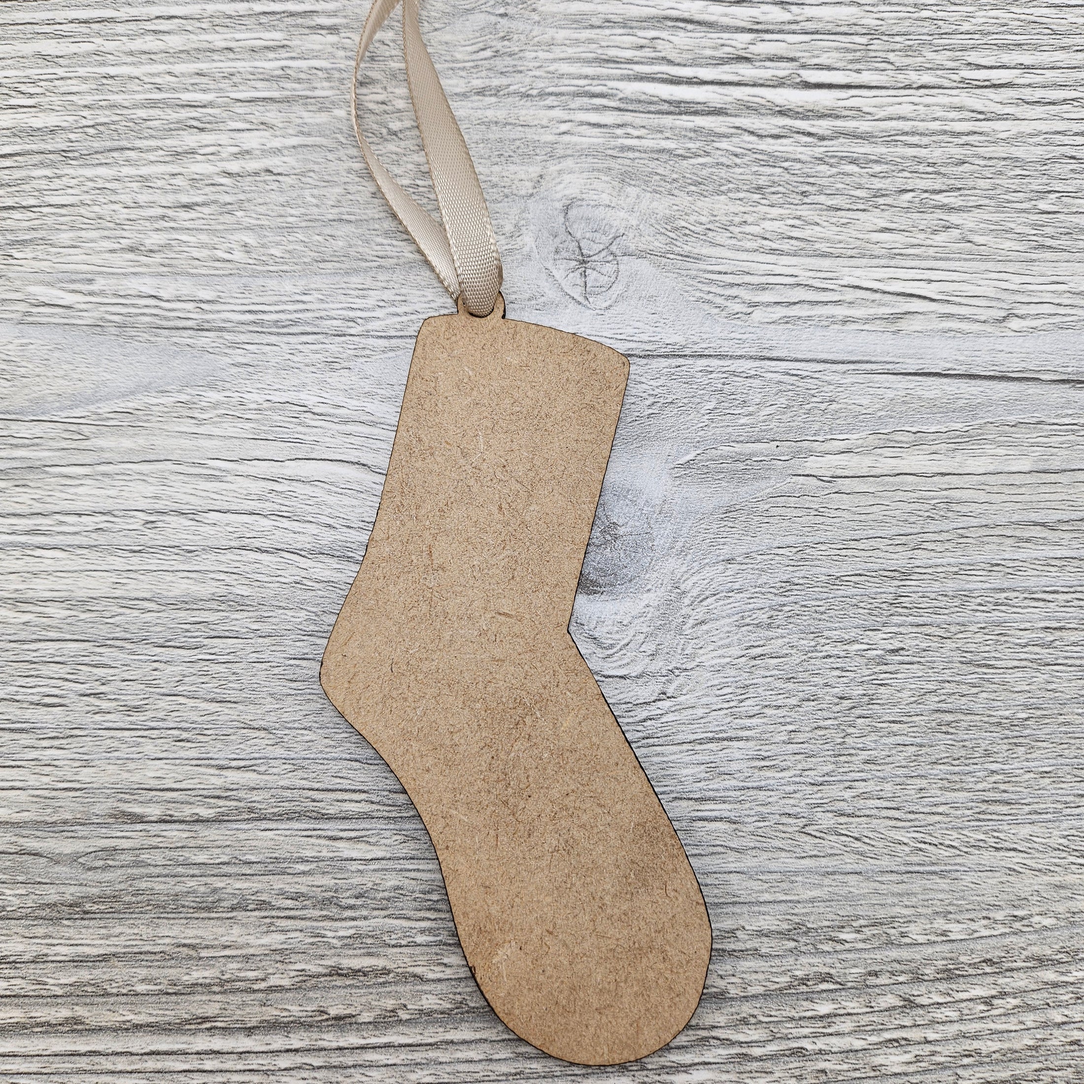 Laser cut sock ornament blank.