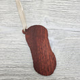 Load image into Gallery viewer, Laser cut exotic bloodwood yarn skein ornament.
