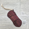 Load image into Gallery viewer, Yarn skein ornament laser cut from exotic purpleheart wood.
