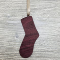 Load image into Gallery viewer, Sock ornament blank laser cut from exotic purpleheart wood.
