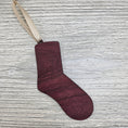 Load image into Gallery viewer, Sock ornament laser cut from exotic purpleheart wood.
