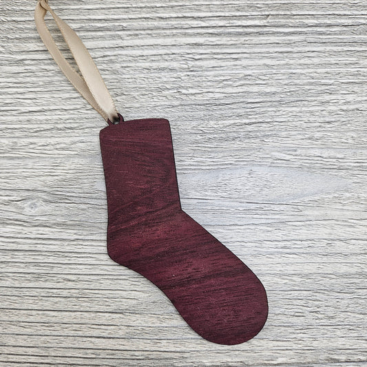 Sock ornament laser cut from exotic purpleheart wood.