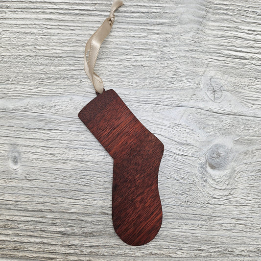 Sock ornament laser cut from exotic bloodwood.