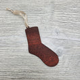 Load image into Gallery viewer, Sock ornament blank laser cut from exotic bloodwood.
