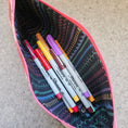 Load image into Gallery viewer, Praise be bitches zipper pouch filled with sharpie markers.

