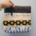 Load image into Gallery viewer, Patchwork clutch purse with exterior cotton fabric.

