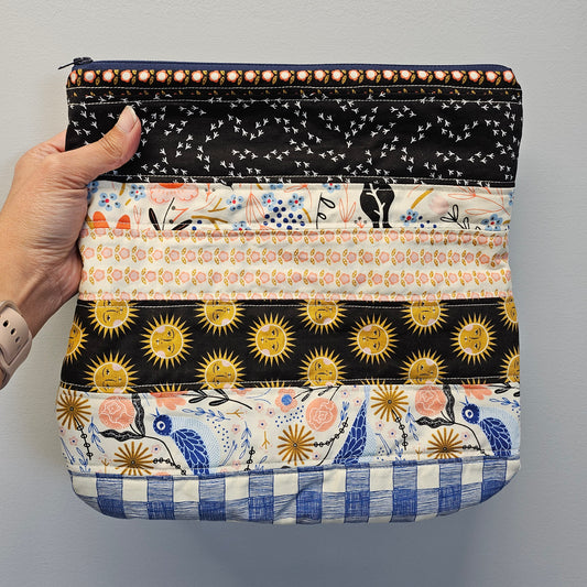 Sun and moon patchwork clutch purse.