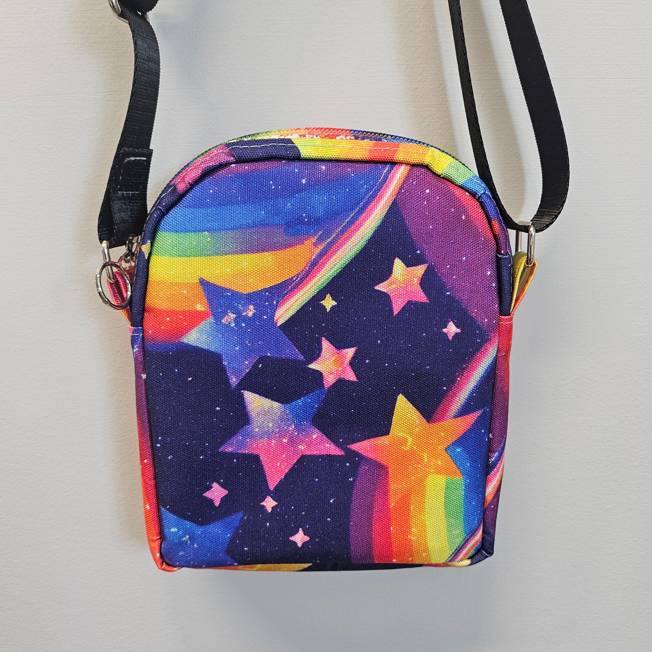 Colorful star-patterned bag with a strap on a light gray background