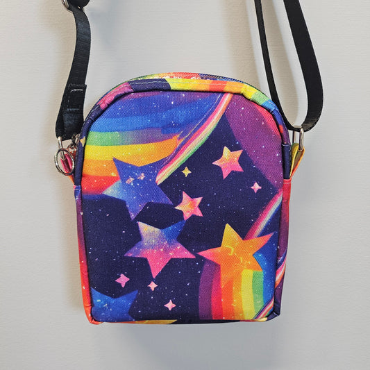 Colorful star-patterned bag with a strap on a light gray background