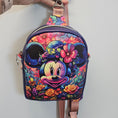Load image into Gallery viewer, Colorful bag with floral and character design on a white background
