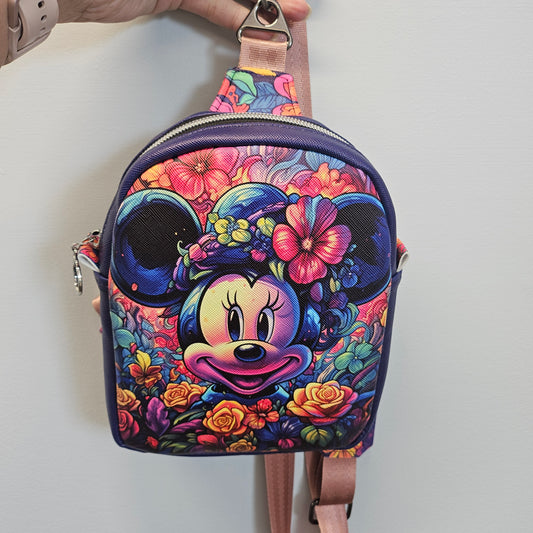 Colorful bag with floral and character design on a white background