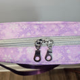 Load image into Gallery viewer, Purple bag with snowflake pattern and silver zipper on a neutral background
